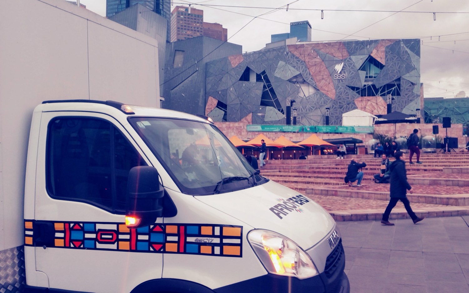 The original Afrofeast Iveco food truck, wrapped in Ndebele patterns, parked at Federation Square in Melbourne